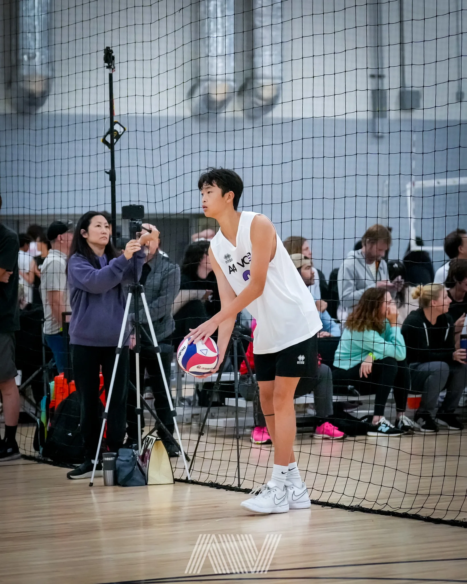A4 Volleyball athletes walking together on court